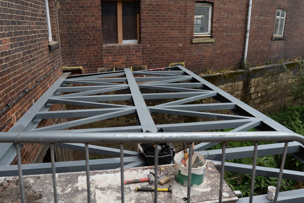 Metalwork in place for the creation of a new bridge over the river between the Island Room and the toilet block